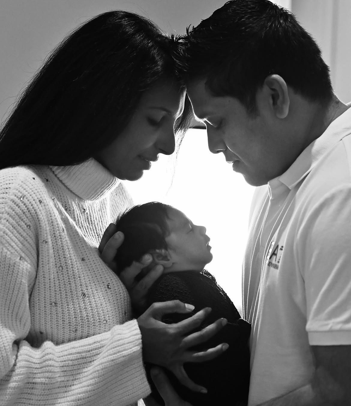 Jay Perera with family and baby